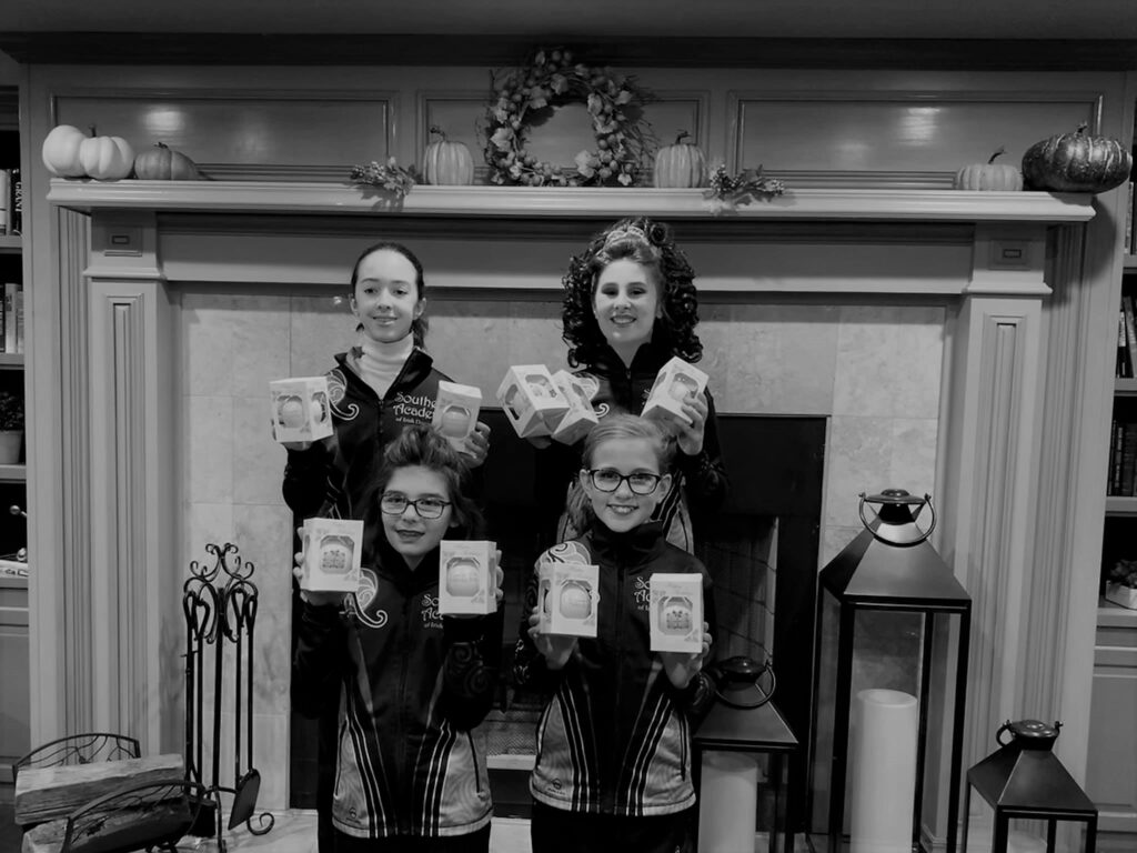 Dancers showing off their awards at the holiday feis in December 2019.